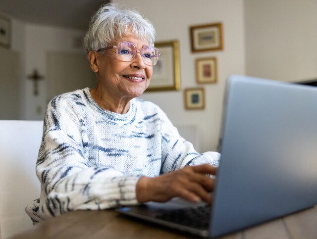 A beautiful senior woman using a laptop